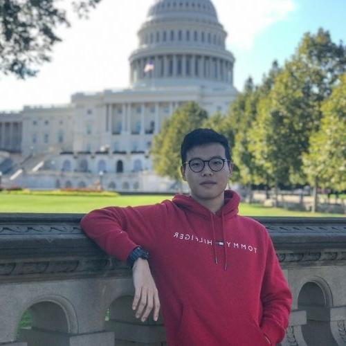 Wai Sum Fung standing in front of the capital building